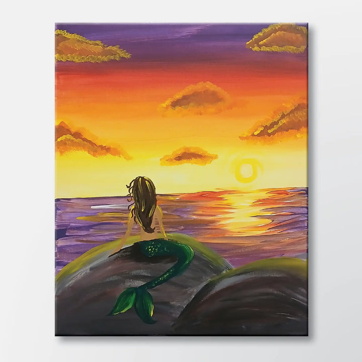 Mermaid Dreams painting kit featuring a mermaid watching an ocean sunset - beginner paint-at-home project with canvas, paints, and video tutorial.