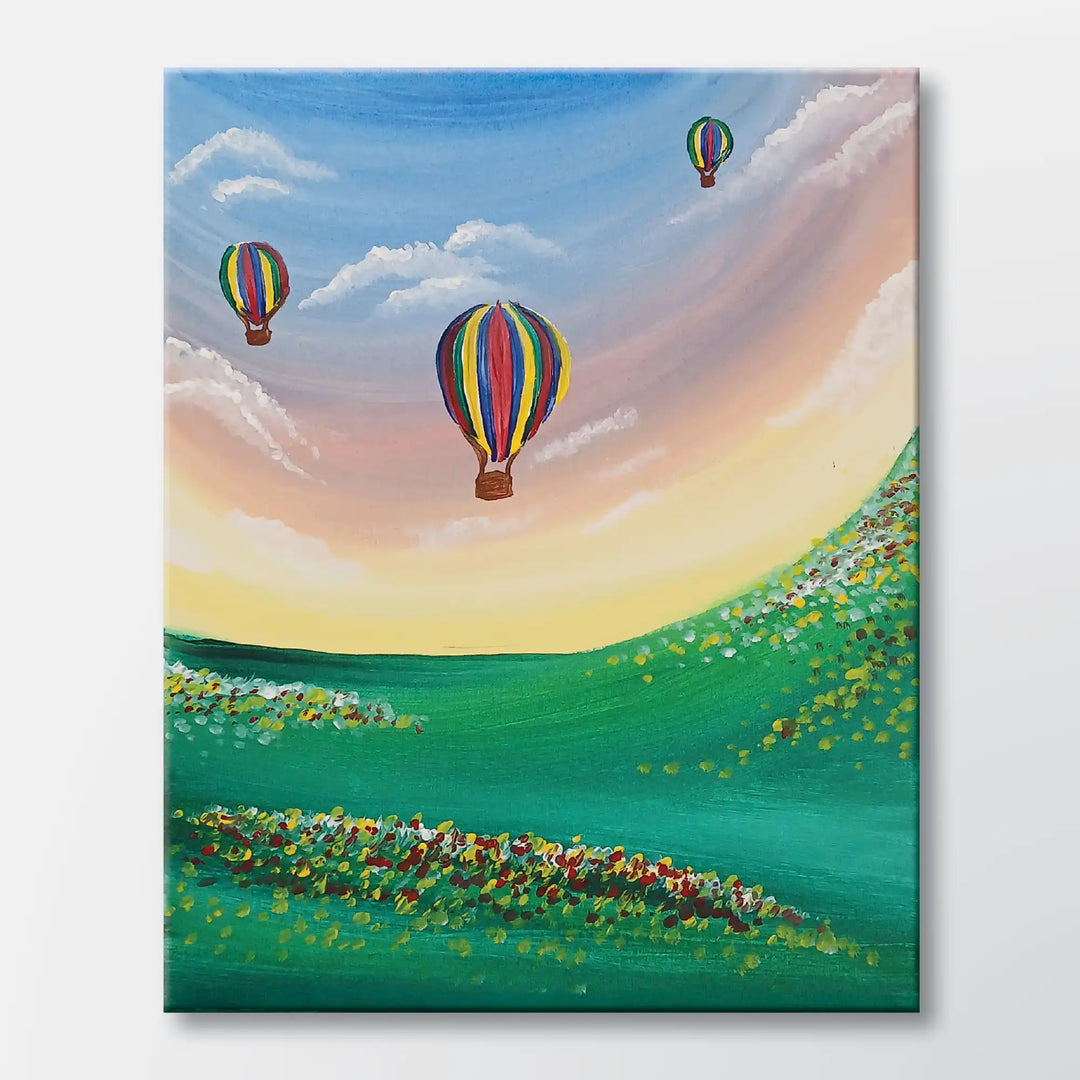 Morning Ascent painting kit featuring three hot air balloons above green hills – beginner paint-at-home project with canvas, paints, and video tutorial.