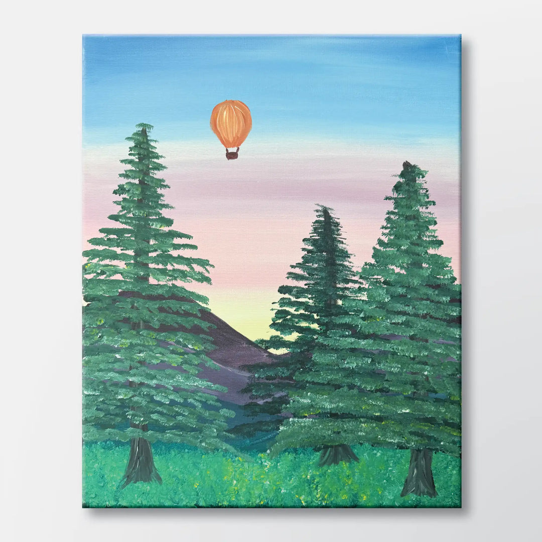 Balloon Over the Pines painting kit featuring a colorful hot air balloon above a forest of pine trees with a soft sky – beginner paint-at-home project with canvas, paints, and video tutorial. 