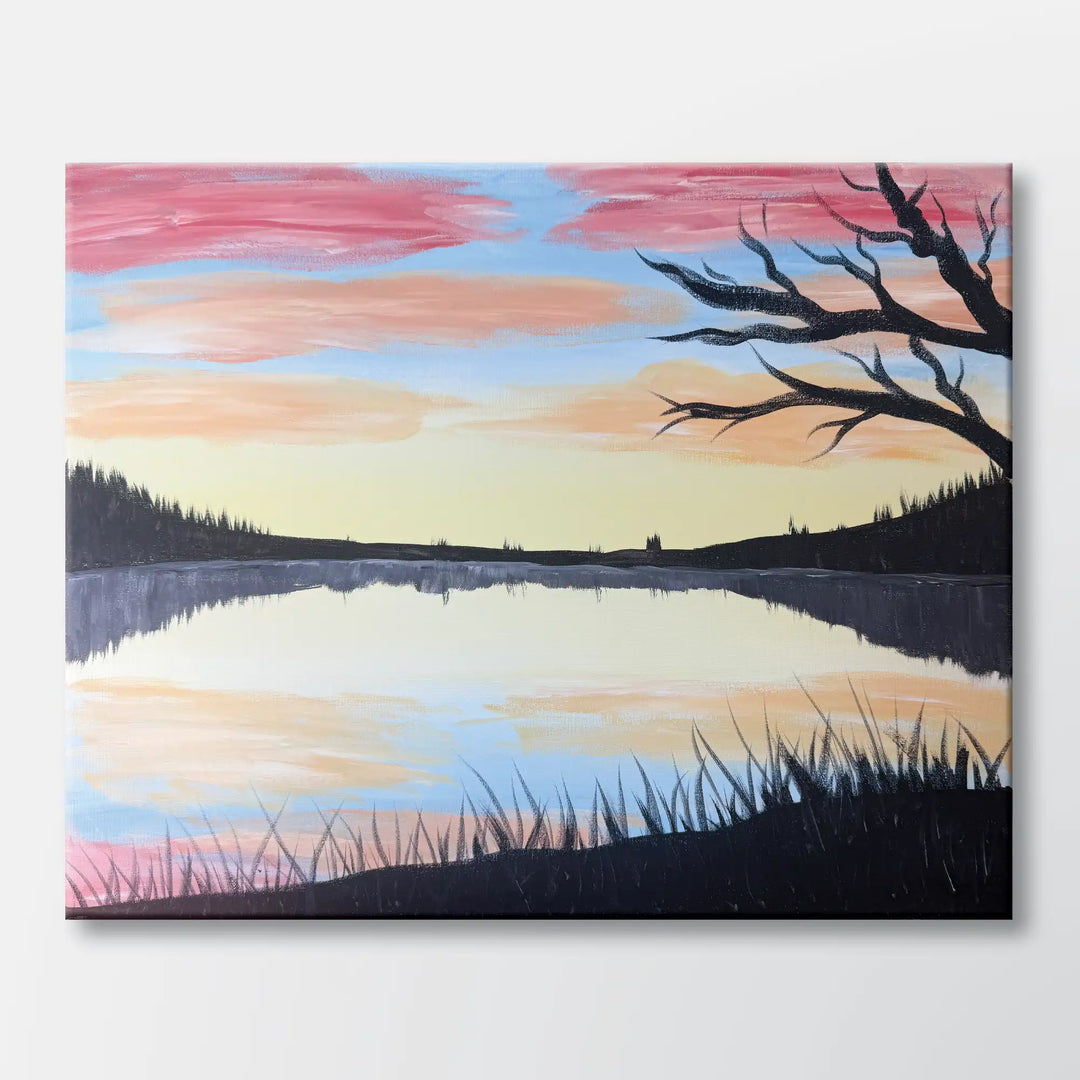 Sunset Reflection painting kit featuring a peaceful lake at sunset with soft grasses, silhouetted trees, and a vibrant sky – beginner paint at home project with canvas, paints, and video.